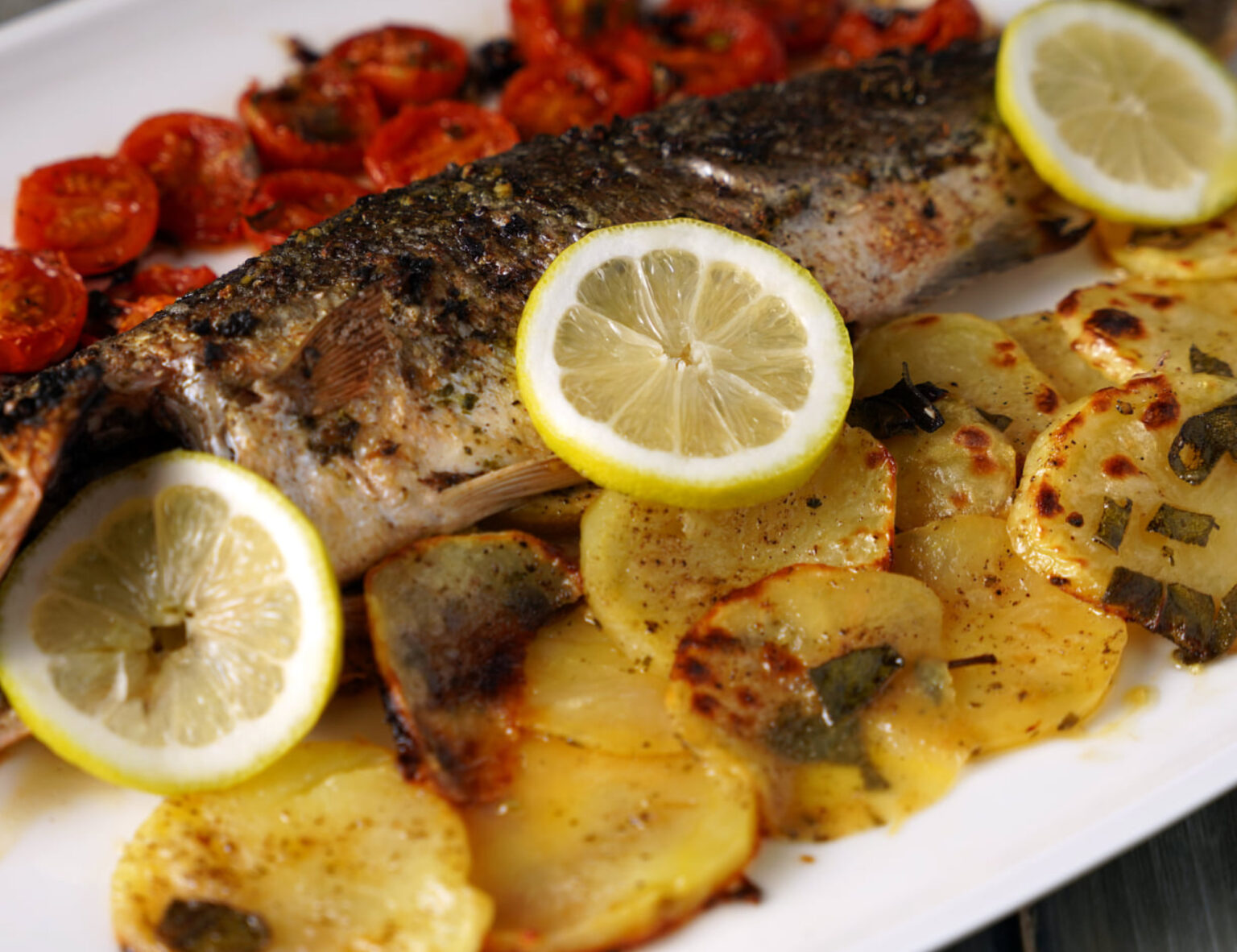 Baked Sea Bass Recipe with Potatoes and Tomatoes