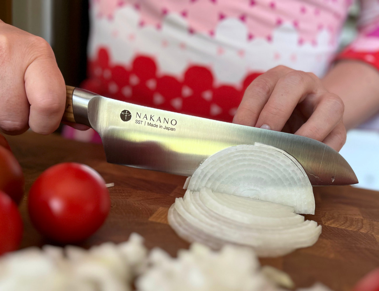 https://www.piattorecipes.com/wp-content/uploads/2023/09/How-to-Pick-the-Best-Kitchen-Knife-Slicing-Onion.jpg